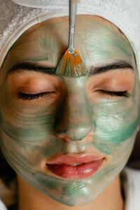 free photo of woman getting a face mask done - Face and Body Institute